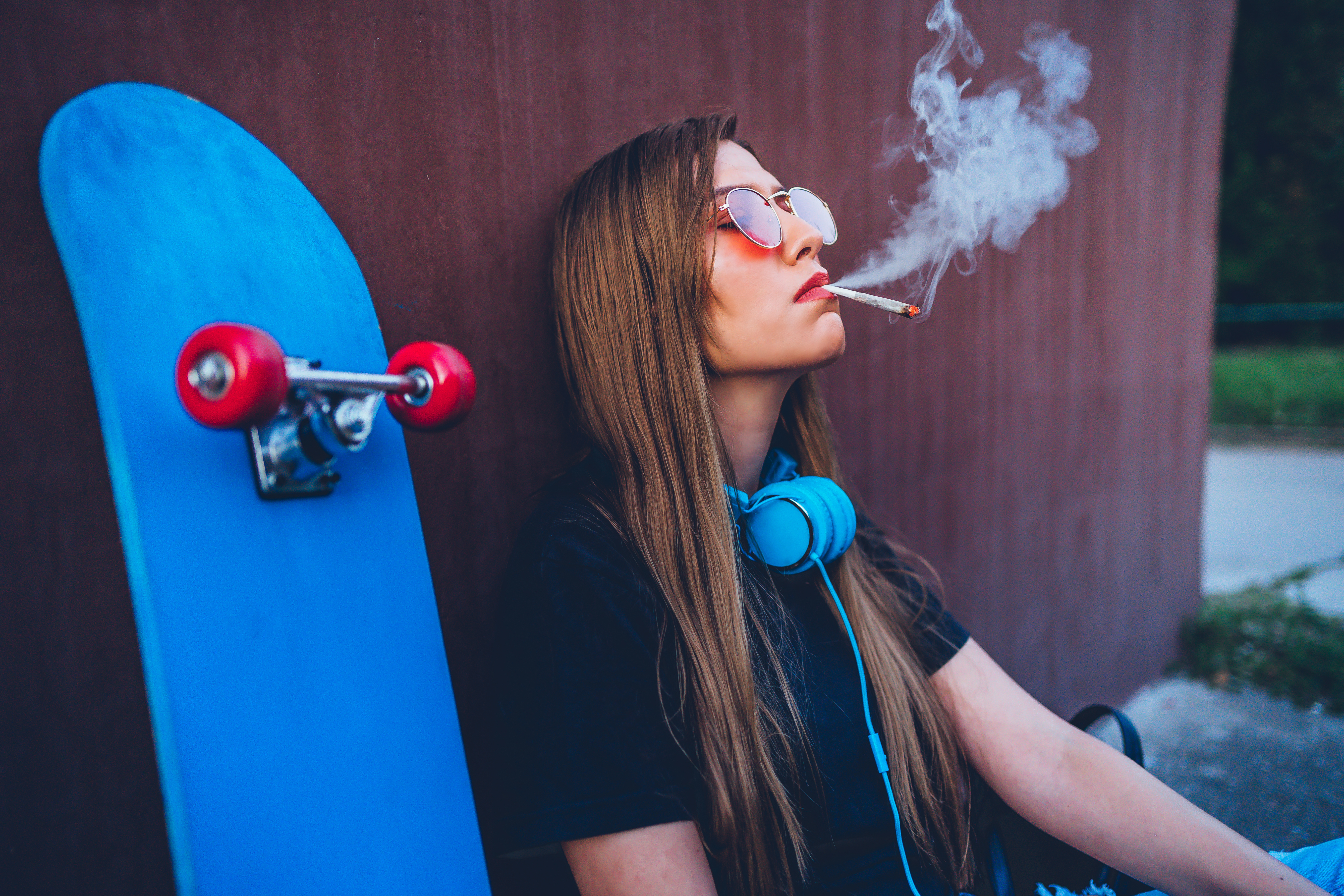 Skateboarder woman smoking